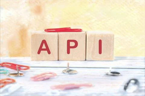 API abbreviation, modern technology concept. API written on wooden cubes on a Stock Photos