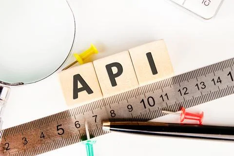 API abbreviation, modern technology concept. API made of wooden cubes on a li Foto stock