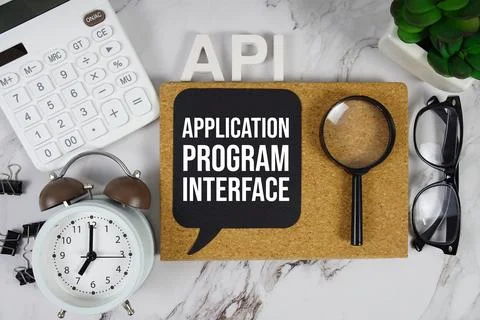 API - Application Program Interface acronym with calculator, alarm clock an.. Stock Photos