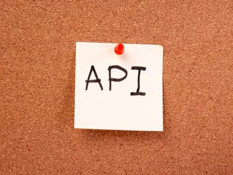 API handwritten on sticky note pinned to cork bulletin board Stock Photos