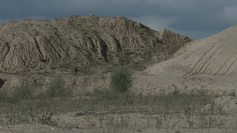 Apocalypse. A lonely warrior wanders through the wasteland. Stock Footage 95417174