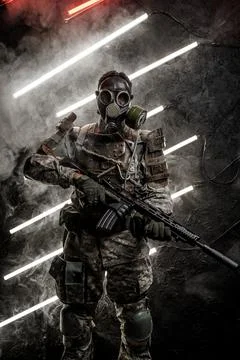 Apocalyptic army soldier with gas mask holding rifle Stock Photos