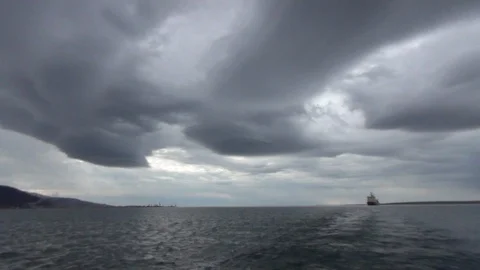 Apocalyptic cloudscape over a boat in the Arctic Ocean Video stock 104874188