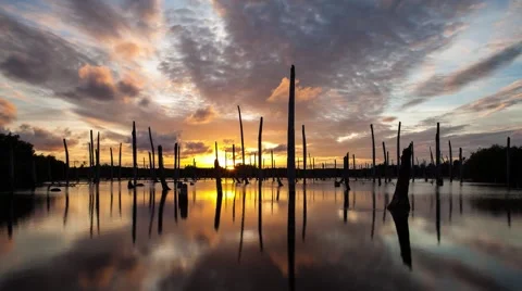 Apocalyptic dramatic clouds and sunset over lake, time-lapse. Stock Footage 48896523