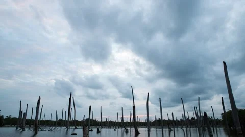 Apocalyptic dramatic clouds and sunset over lake, time-lapse. Stock Footage 48956277