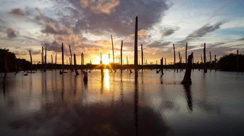 Apocalyptic dramatic clouds and sunset over lake, time-lapse Stock Footage 49326340
