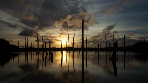 Apocalyptic dramatic clouds and sunset over lake, time-lapse. Stock Footage 50609671