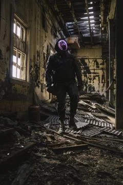 Apocalyptic Explorer Wanders Through Abandoned Location Stock Photos