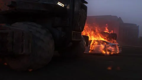 Apocalyptic war machine drives through a destroyed burning city. Stock Footage 313505186