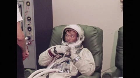 Apollo 11 Astronaut Michael Collins suiting up for spaceflight to the moon Stock Footage 269506653