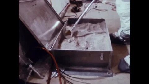 Apollo 11 training - Astronaut test take soil sample in plane low weightlessness Stock Footage 114218805