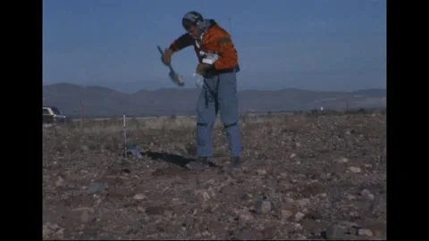 Apollo 14 Astronaut Alan Shepard collecting rock samples during geology training Stock Footage 274336146