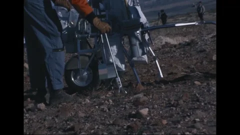 Apollo 14 Astronaut Alan Shepard collecting samples training at volcanic site Stock Footage 274336170