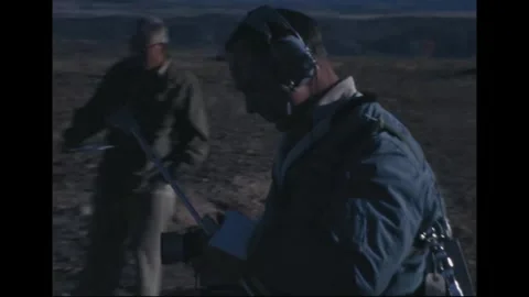 Apollo 14 Astronaut Edgar Mitchell training with camera at volcanic site Video stock 274336142
