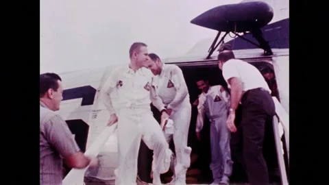 Apollo 8 astronauts Borman, Anders and Lovell arrive on recovery ship Stock Footage 263452393