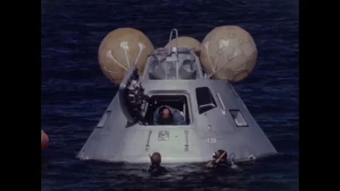 Apollo 8 backup crew open command module door during water egress training Stock Footage 271518168