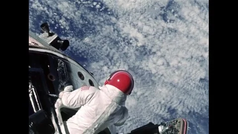 Apollo 9 astronaut Extravehicular Activity over Earth Stock Footage 263452307