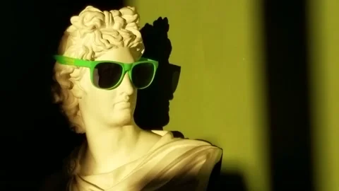 Apollo Belvedere bust replica with cool sunglasses funny style stylish Stock Footage 189992298