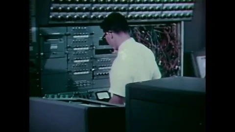 An Apollo Docking Simulation is tested with a model and a computer, in 1972. Video stock 83169817