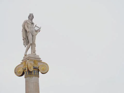 Apollo marble statue isolated on almost white sky background, space for text Stock Photos