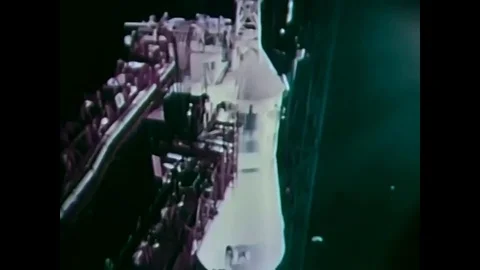 An Apollo rocket launches, Mission Control tracks and astronauts place seismic Stock Footage 83169904