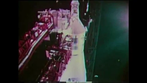 An Apollo rocket launches, Mission Control tracks and astronauts place seismic Stock Footage 145481889