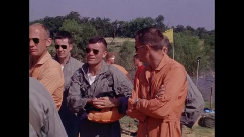 Apollo Space program astronauts briefing on beach prior to parachute training Vídeos de archivo 263453072