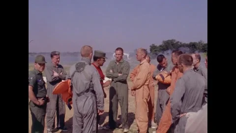 Apollo Space program astronauts briefing on beach prior to parachute training 動画素材 263453088