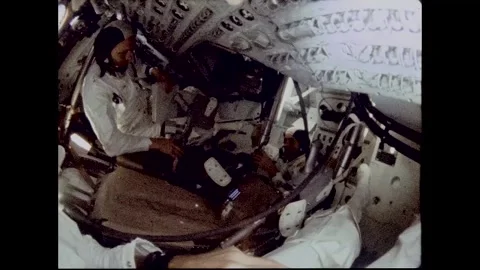 Apollo Space Program onboard view of astronauts demonstrating zero gravity Stock Footage 263452444