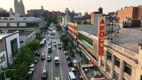 Apollo Theater backing up from bright red sign 125th street Harlem New York  Stock Footage 214248038