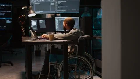 App developer with physical disability working on IT software coding Stock Photos