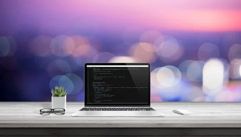 App development on laptop computer with code editor on display. Stock Photos