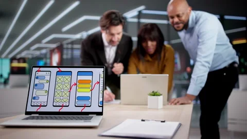 App Development Team Reviewing UI Design Stock Footage 331153478