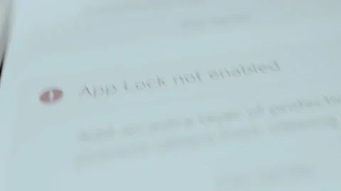 App Lock not enabled security notification, user taps the FIX NOW option Stock Footage 329749084