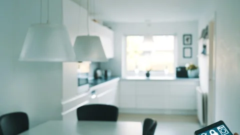 App on mobile phone controls light from lamps in smart home Stock Footage 101829465