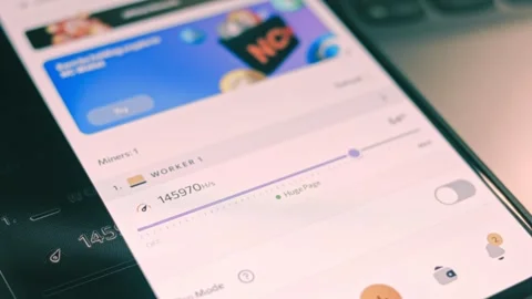 App on mobile phone showing the hash power per second for mining. Mining concept Stock Footage 249887410