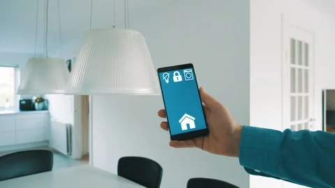 App on smart phone turns on light bulbs in smart home Video stock 101831543
