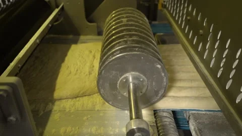Apparatus cutting dough into baguettes. Bread production at the factory Stock Footage 170132840