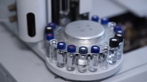 Apparatus with test tubes rotates around axis inside laboratory Stock Footage 76530316