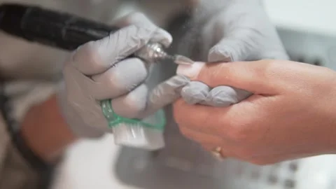 Appartized manicure of nails on a womans hand, cuticle removal. Stock Footage 310172280