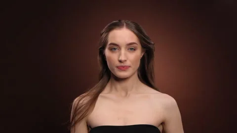 Appear beautiful model lifts her head waving her long healthy hair in the air Stock Footage 147167161