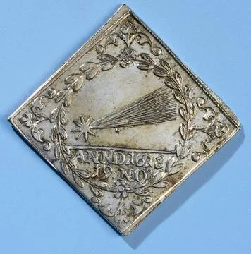 Appear from a comet. Rectangular silver medal. Front: comet within a bran ... Stock Photos
