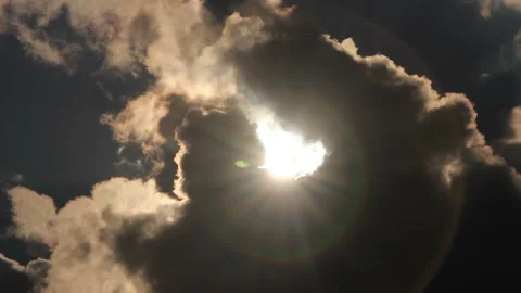 Appear sun behind clouds Stockbeeldmateriaal 104715363