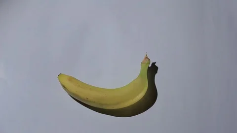 Appearance of bananas on a white background, stop motion, animation. Stock Footage 76092668