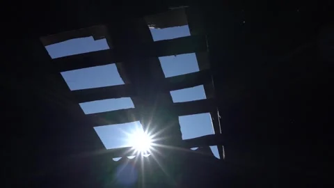 The appearance of Blue Sky Sunlight through a hole in the roof of the house Stock Footage 240725811
