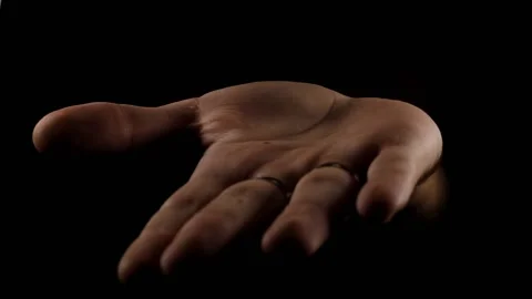 The appearance of a hand on a black background shows gestures and disappears 스톡 동영상 200874264