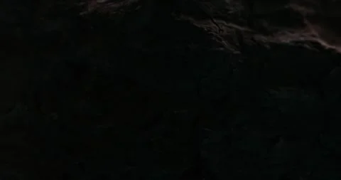 Appearance out of darkness Rugged Terrain of Reddish-Brown Rock. Stock Footage 271322231