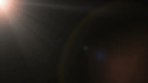 The appearance of rays of light with glare on a black background. Animation Stock Footage 320901319