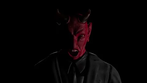 Appearance of red devil from the darkness. Demon bark or growl.  Stock Footage 227699037