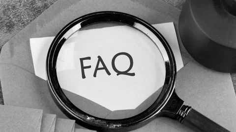 The appearance of text FAQ through a magnifying glass on a white sheet Stock Footage 279392582